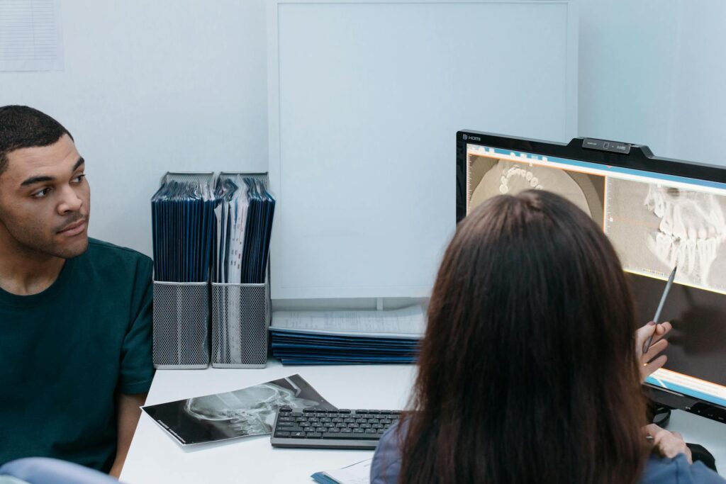 a dentist having a consultation with a patient