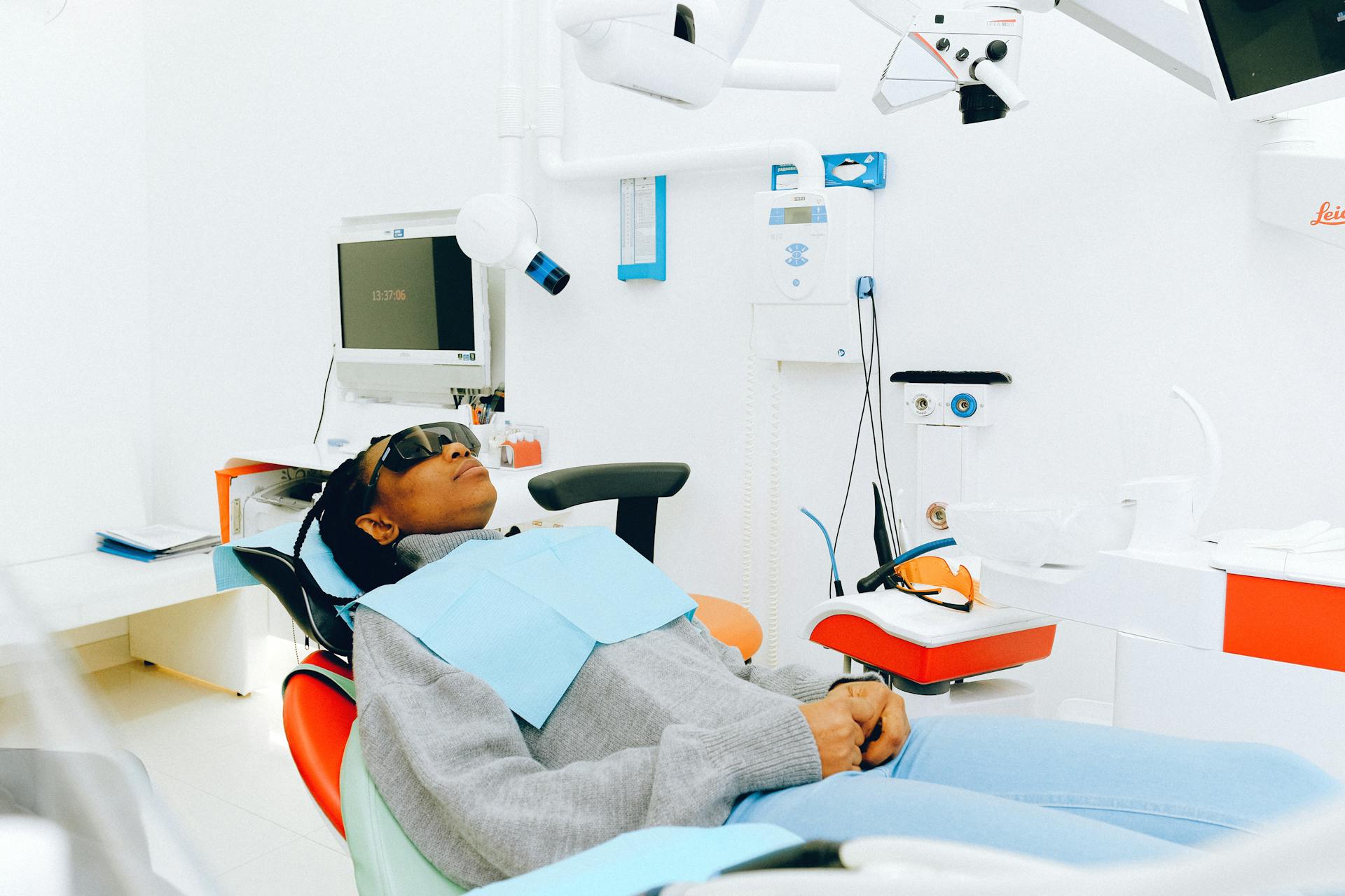 A patient lying down on a dental chair